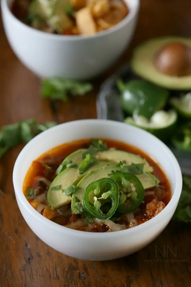 Slow Cooker Beef Chorizo Taco Chili in a bowl topped with avocado. 