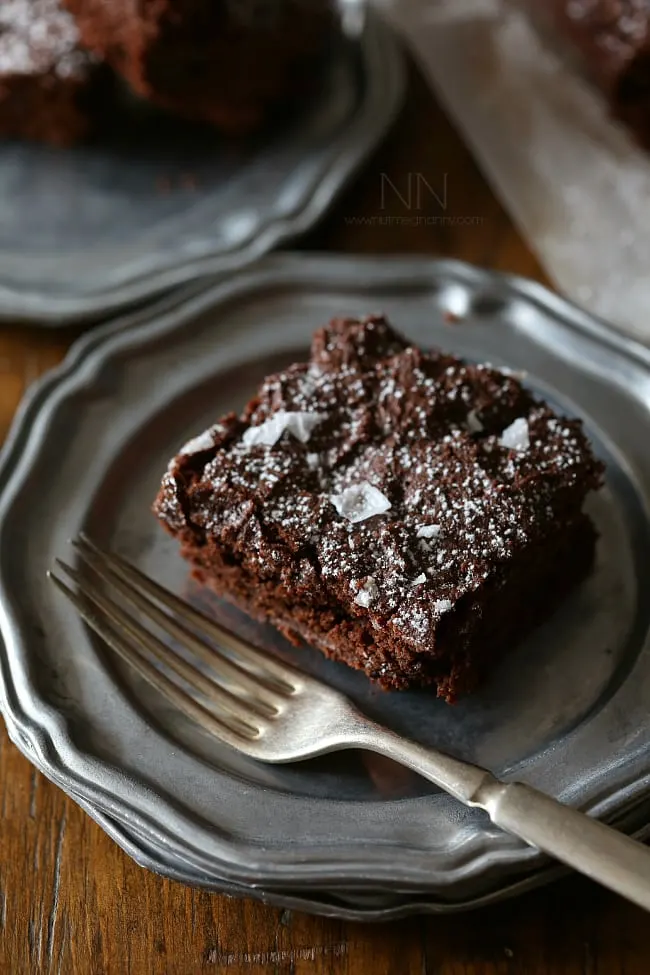 These dark chocolate yogurt brownies are packed full of rich chocolate flavor and a hint of tangy yogurt flavor. Top with flaked sea salt and powdered sugar.