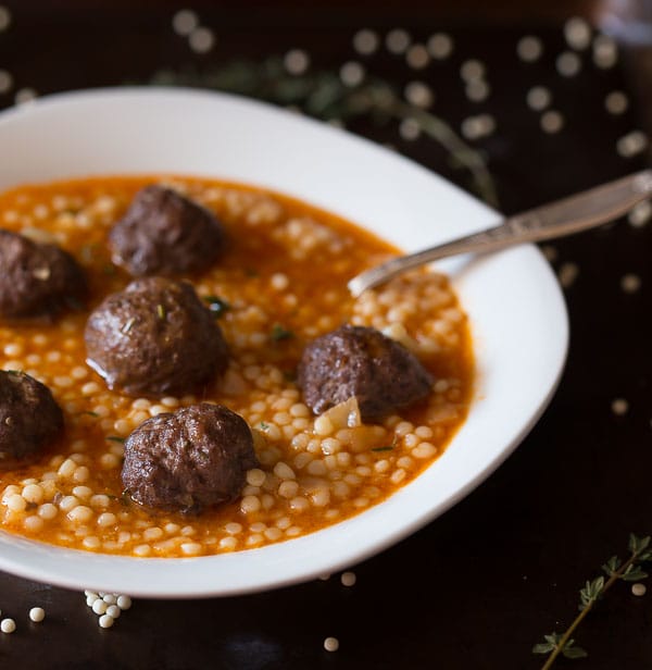 This lamb meatball couscous soup is packed full of flavor and ready in under an hour. Homemade meatballs swimming in a simple broth with hearty couscous. 