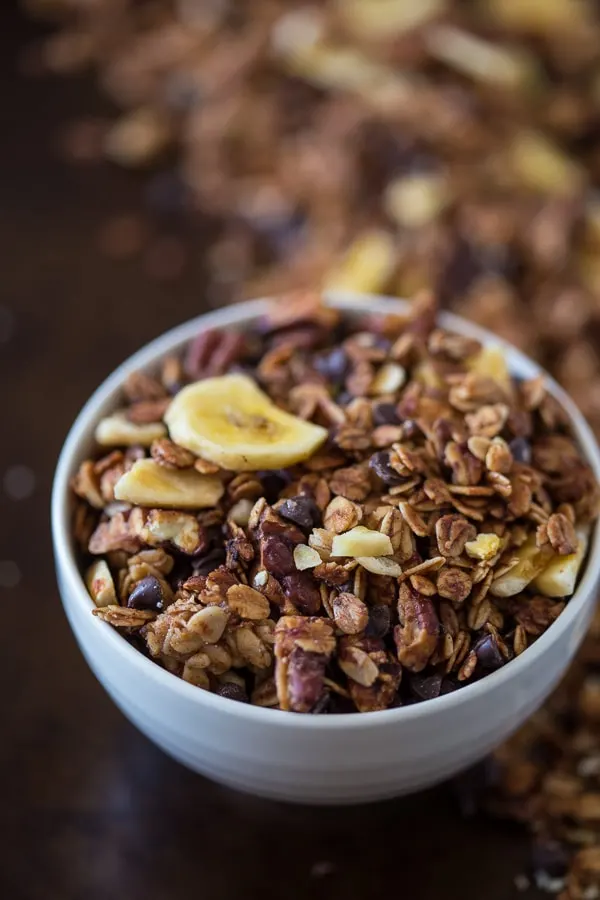 This banana bread granola is packed full of gluten free oats, mashed bananas, banana chips, mini dark chocolate chips and lots of cinnamon spice. Plus it taste just like fresh baked banana bread!