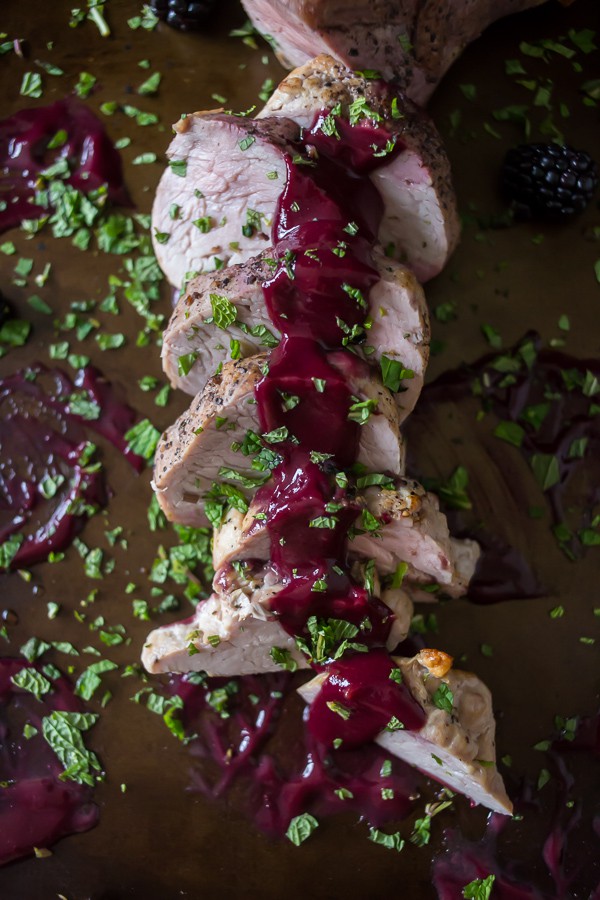 This perfectly cooked pork tenderloin with blackberry mint sauce is packed full of sweet fruity flavor. Blackberries combined with mint, port wine and sweet maple syrup. #PinkPork