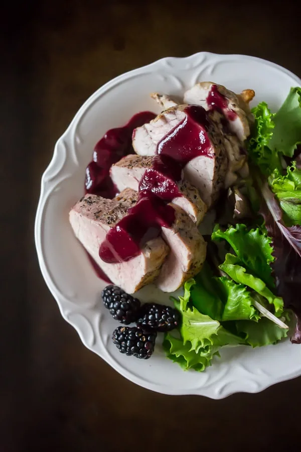 This pork tenderloin with blackberry mint sauce is packed full of sweet fruity flavor. Blackberries combined with mint, port wine, sweet maple syrup and a hint of orange #PinkPork