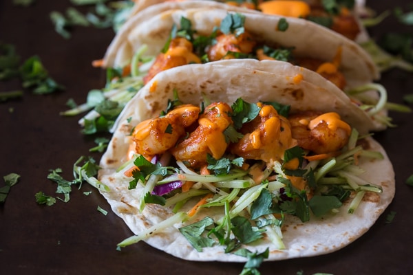 These chipotle shrimp tacos are the perfect balance of sweet and spicy. Flour tortillas topped with tangy broccoli slaw, shrimp and flavorful gochujang mayonnaise.
