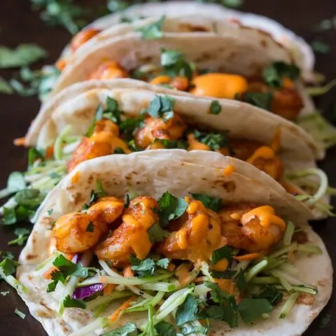 These chipotle shrimp tacos are the perfect balance of sweet and spicy. Flour tortillas topped with tangy broccoli slaw, spicy shrimp and flavorful gochujang mayonnaise.