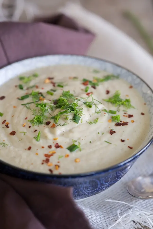 This comforting roasted cauliflower fennel leek soup is made in your Vitamix and ready in under 30 minutes. Perfect for cool spring nights and packed full of delicious roasted vegetable flavor. This is the perfect busy weeknight bowl of soup.