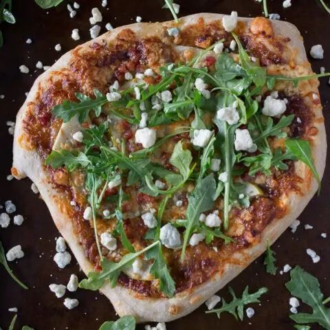 This apple butter blue cheese pancetta pizza is the perfect addition to your weeknight menu. It's sweet, savory and oh so delicious. Plus it's ready in only 30 minutes!