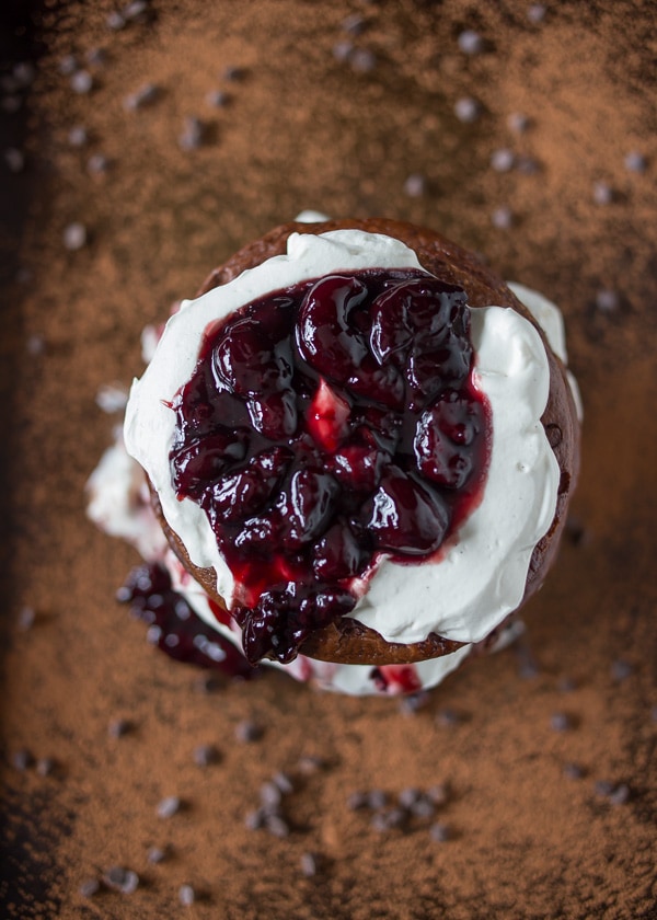 These fluffy gluten free black forest pancakes are layered with sweet breakfast flavor. Super chocolaty gluten free pancakes paired with cherries and vanilla whipped cream. 