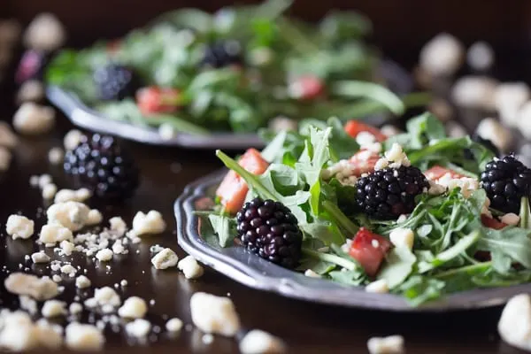 This black and blue salad with crispy ham is the perfect summer salad. A delicious combo of arugula, crispy ham, blackberries and blue cheese. You'll love this fun summer salad!