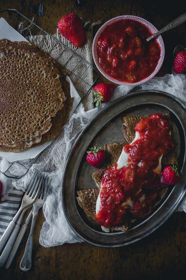 These buckwheat crepes with strawberry rhubarb compote and vanilla creme fraiche are the perfect way to celebrate spring. Plus they are naturally gluten free!