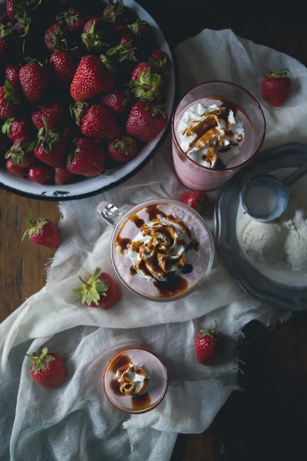 This strawberry creme fraiche milkshake with balsamic vinegar drizzle is the perfect summer treat. Perfectly chilled and great for summer porch sipping.