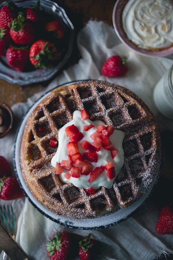 These strawberry yogurt waffles are the perfect way to start your day. These light and fluffy waffles are made with honey yogurt and fresh strawberries.