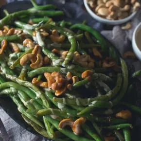 These Girl and the Goat Magic Beans taste just like beans you can get in the Chicago restaurant. Perfectly crisp, flavorful and ready in no time. Flavored with fish sauce vinaigrette and sautéed with crunchy cashews.