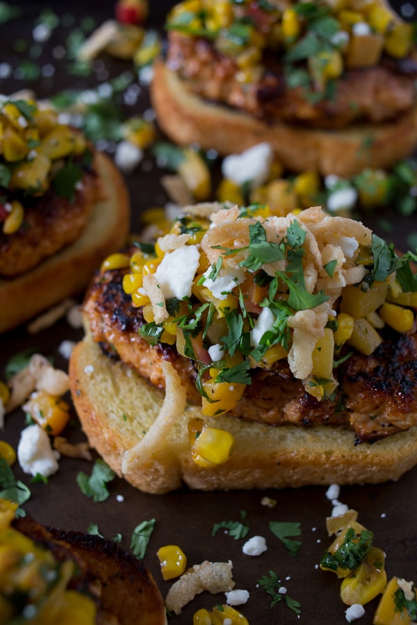 This open face bbq chicken burger with peach corn salsa is the perfect summer burger. Deliciously spiced with the perfect balance of sweet and savory. Ground chicken mixed with smoked paprika, chili powder and bbq sauce all cooked up to perfection, served on Texas toast and topped with sweet and savory peach corn salsa, cotija cheese and crispy fried onions. You'll have a hard time not wanting to eat this burger all summer long!