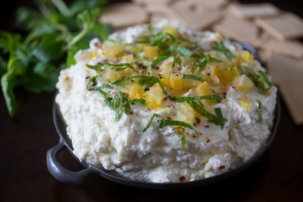 Preserved Lemon and Mint Whipped Feta Dip in a metal serving dish. 