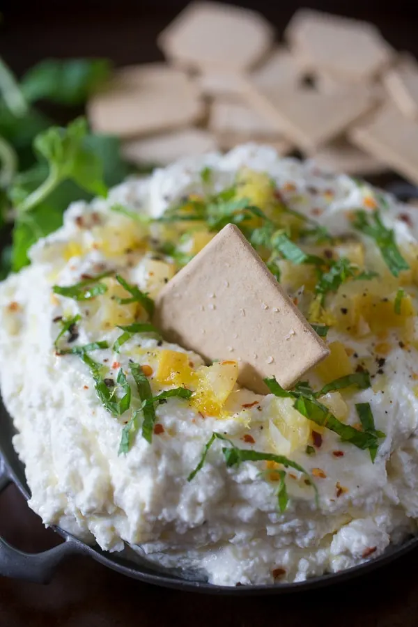Preserved Lemon and Mint Whipped Feta Dip served with crackers. 
