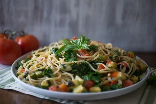 This zucchini tomato kale pasta packs all the flavors of summer into one pasta dish. Simple to throw together and ready in under 30 minutes!