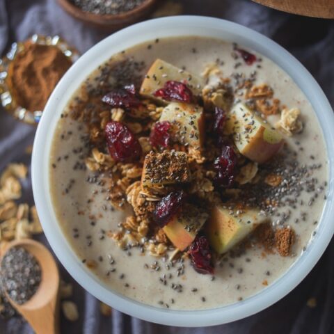 This apple pie smoothie bowl tastes just like apple pie without all the calories found in traditional dessert. It's topped with fresh cut apples, apple pie spice, granola, chia seeds and dried cranberries. This is the perfect way to start your day!