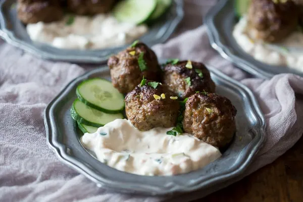 These spicy meatballs with yogurt dipping sauce are the perfect appetizer or main course. Slightly spicy and perfectly cooled down when dipped. You'll love this combo!