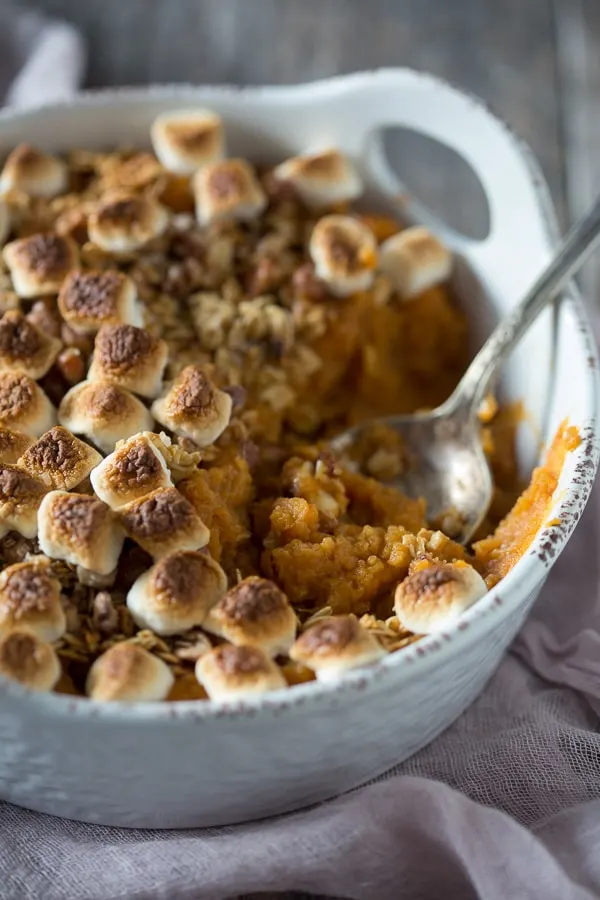 Vanilla Sweet Potato Casserole with a spoon in the dish. 