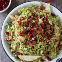This shaved Brussels sprouts apple bacon salad is the perfect combo of sweet, salty and savory. Super easy to make and drizzled with a maple vinaigrette.