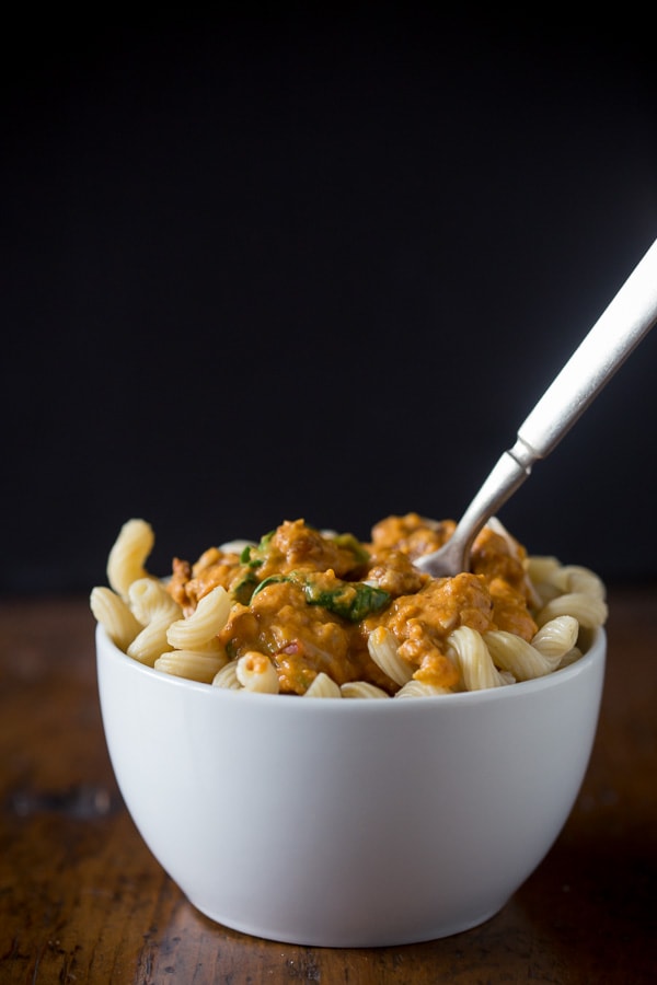 This spicy sausage pumpkin pasta sauce is packed full of delicious pumpkin and is perfect served over pasta, ravioli or gnocchi. Super simple to make and packed full of fall flavor.