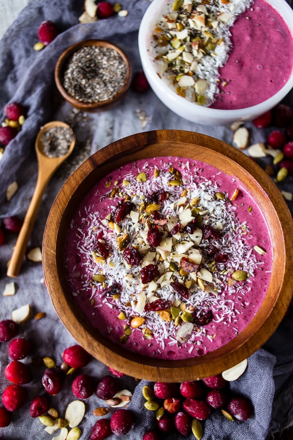 Cranberry Smoothie Bowl sitting on a table with another small bowl of smoothie. 