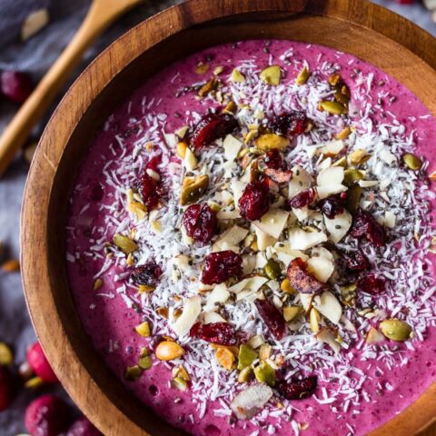 This cranberry smoothie bowl is packed full of cranberries, mixed berries, bananas, almond milk and topped with coconut, chia seeds and nuts. It's healthy, delicious and the perfect holiday rush breakfast.
