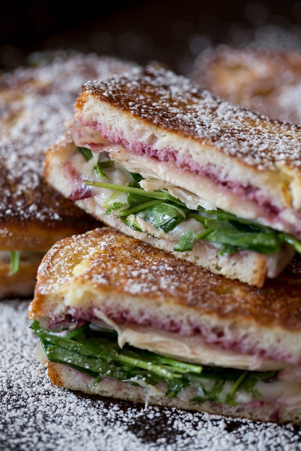 This turkey monte cristo is made with cranberry sauce, arugula, leftover turkey and Swiss cheese. Perfectly grilled and gluten free! This is the perfect sandwich for using up all those Thanksgiving leftovers!