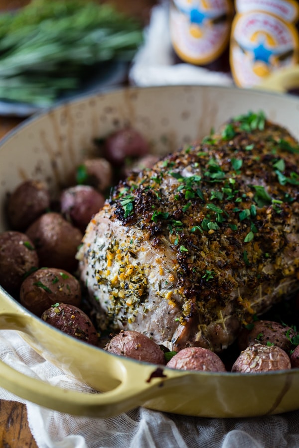 This citrus herb crusted pork roast is perfect for the holidays. Rubbed down with flavor packed topping and roasted with small baby potatoes. Easy and delicious!