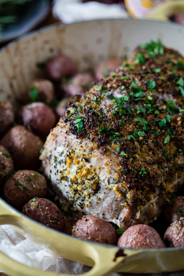 This citrus herb-crusted pork roast is perfect for the holidays. Rubbed down with flavor packed topping and roasted with small baby potatoes. Easy and delicious!