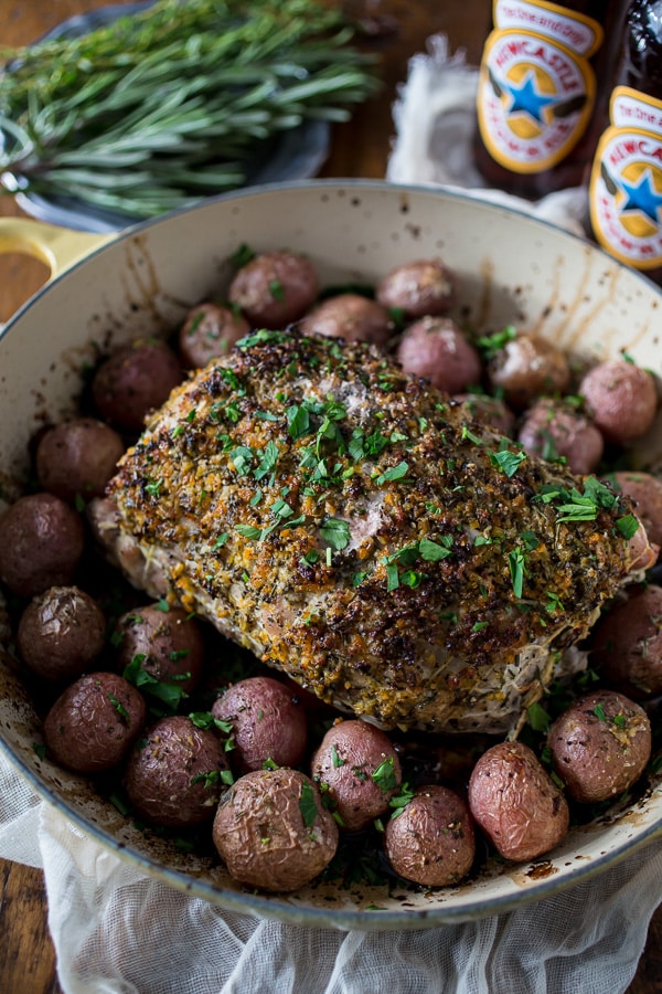 This citrus herb crusted pork roast is perfect for the holidays. Rubbed down with flavor packed topping and roasted with small baby potatoes. Easy and delicious!