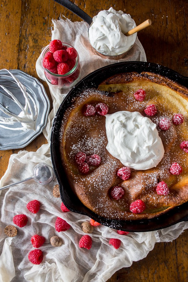 This eggnog Dutch baby is spiced with holiday flavor and topped with a homemade nutmeg whipped cream. So deliciously perfect in every single way.