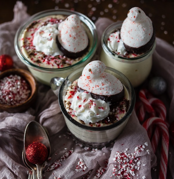 This no bake peppermint cheesecake is perfect for the holidays. Light and fluffy and topped with whipped cream, crushed peppermint candies and PEEPS.