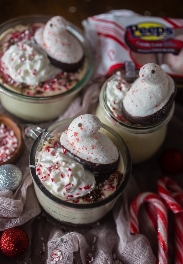 This no bake peppermint cheesecake is perfect for the holidays. Light and fully and topped with whipped cream, crushed peppermint candies and PEEPS.