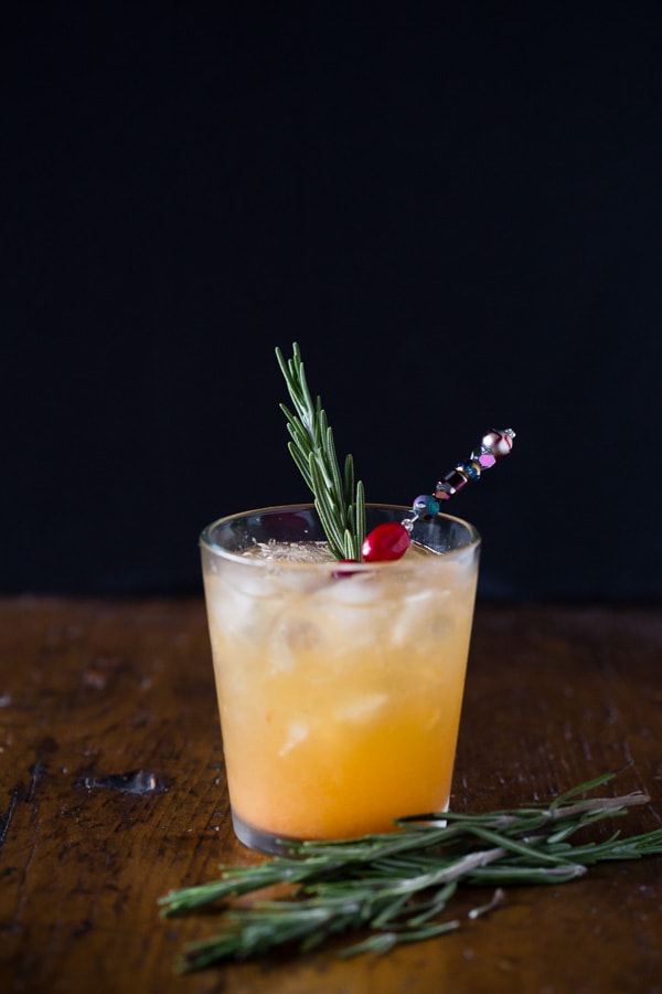 This persimmon old fashioned cocktail is a tasty winter libation. Made with a sweet persimmon puree, rye and just a touch of seltzer. So easy to make and drink!