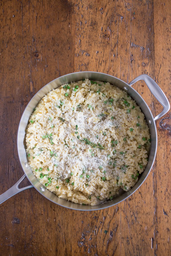 This pea Parmesan risotto is minimal stir and turns out perfectly creamy. It's packed full of fresh lemon zest, sweet spring peas and sharp Parmesan cheese.