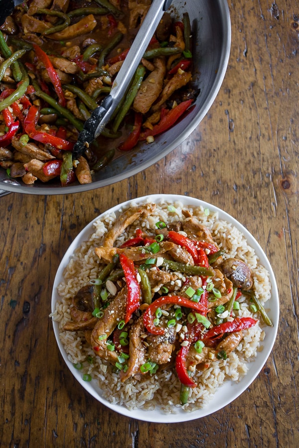 Spicy Garlic Pork Stir Fry served on a plate with rice. 
