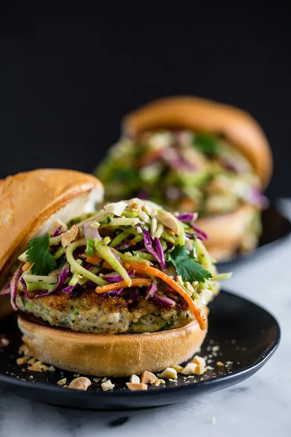 These Thai chicken burgers are packed full of fresh herbs and topped with a crunchy vegetable slaw tossed with a peanut butter dressing. Ready in about 30 minutes and LOADED with flavor!