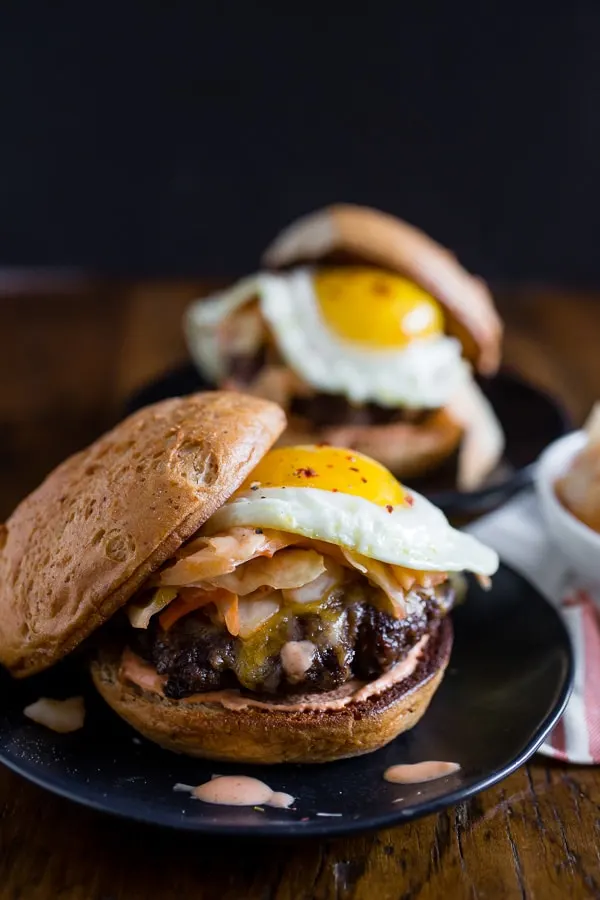 This kimchi burger is topped with a fried egg and TONS of kimchi. You'll love all the flavor that is PACKED into these burgers! Say goodbye to boring burgers.
