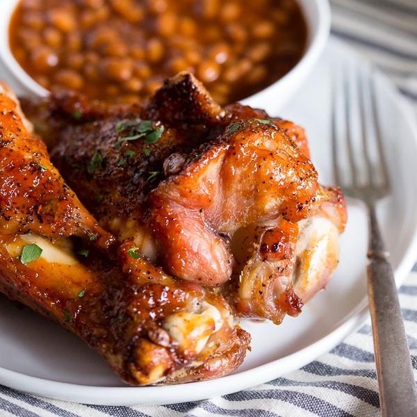 These peach bbq grilled turkey legs are the perfect summertime meat treat. Slathered with a homemade peach bbq sauce and grilled to perfection.