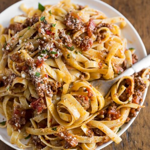 This slow cooker Parmesan meat sauce is slow cooked and full of flavor. Perfectly seasoned and goes great over fresh pasta. It can be easily frozen so you can have fresh sauce any day of the year!