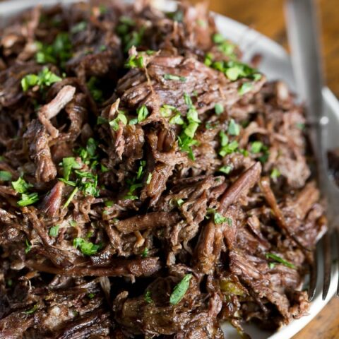This homemade Mississippi roast is made in the slow cooker and packs some big flavor. Serve over egg noodles, mashed potatoes or even piled high on a bun. Plus this version is 100% homemade so it uses ingredients easily found in your pantry and no flavor packets!
