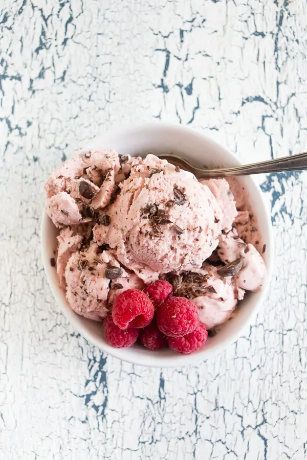 This raspberry chocolate chip ice cream is the perfect addition to your summer menu. Slightly sweet, full of fresh berry flavor and packed with dark chocolate chips. You'll love how easy it is to make your own ice cream!