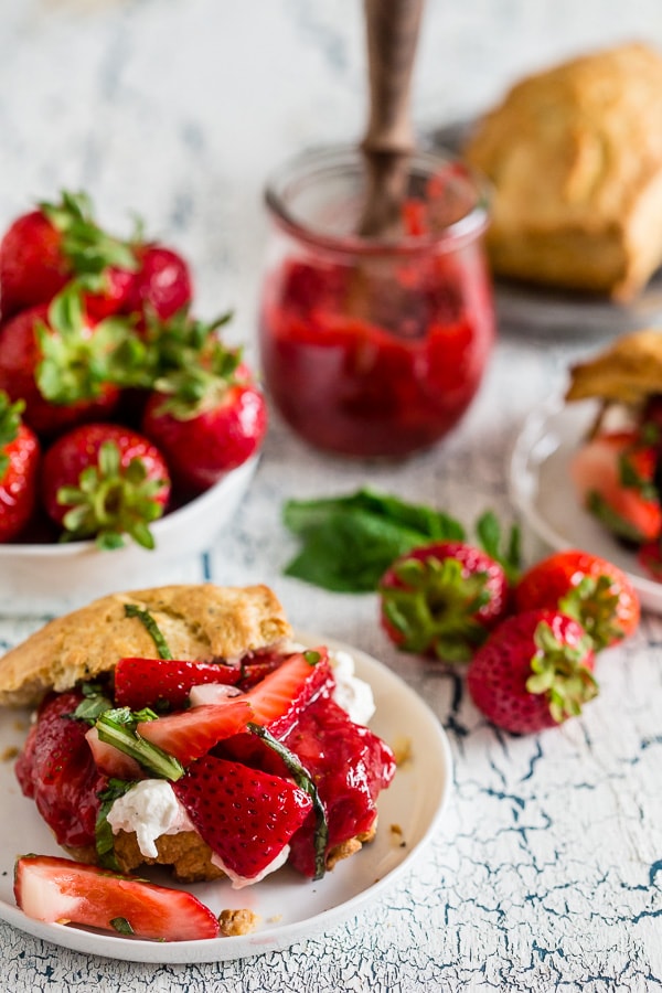 This strawberry basil shortcake is the perfect summertime dessert. Tender shortcake biscuits topped with homemade strawberry jam, macerated berries with basil and fresh whipped cream. So easy and delicious you'll want to make it all summer long. 