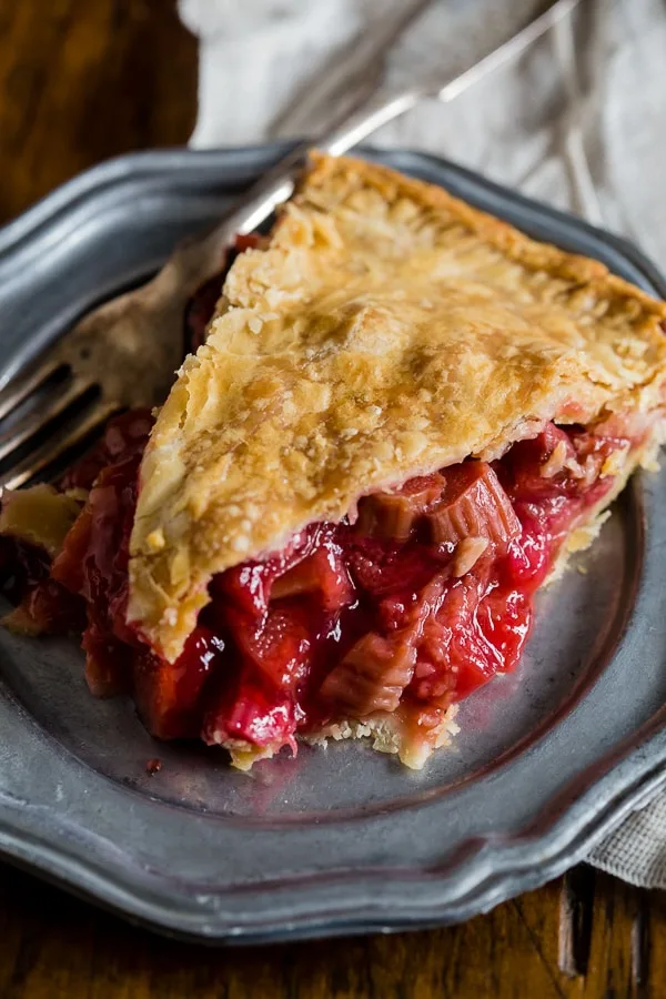 This homemade strawberry rhubarb pie is the quintessential summer pie. Filled with sun-ripened strawberries and tart rhubarb. Serve warm, room temperature or with a big giant scoop of ice cream.