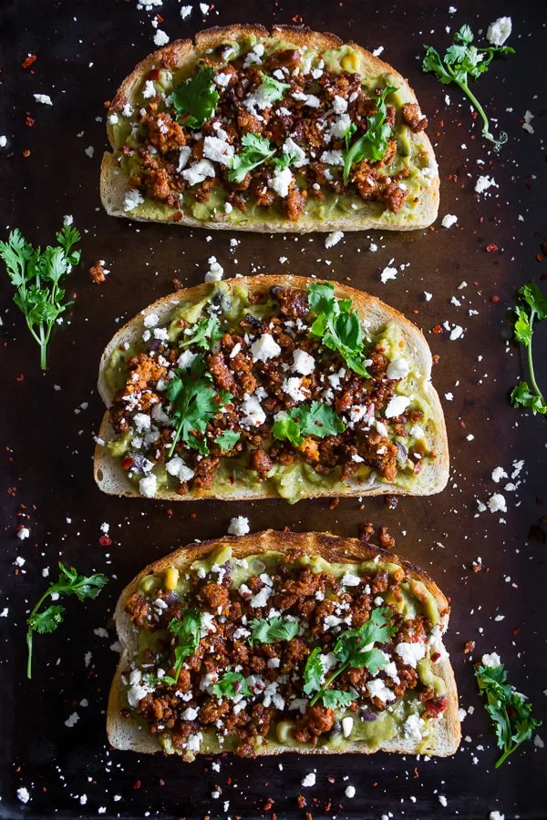 This chorizo cotija guacamole toast is a great way to start the day OR a delicious mid-day treat. Savory guacamole mixed with fresh vegetables and topped with spicy chorizo, salty cotija and a sprinkling of cilantro. You're going to go crazy over this delicious toast!