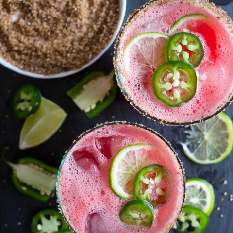 This jalapeno watermelon margarita is your new favorite margarita. The perfect balance of sweet and spicy and made with fresh pureed watermelon and spiked with jalapenos and just a splash of tequila, lime juice and orange liqueur. This is the spicy cocktail of your dreams.