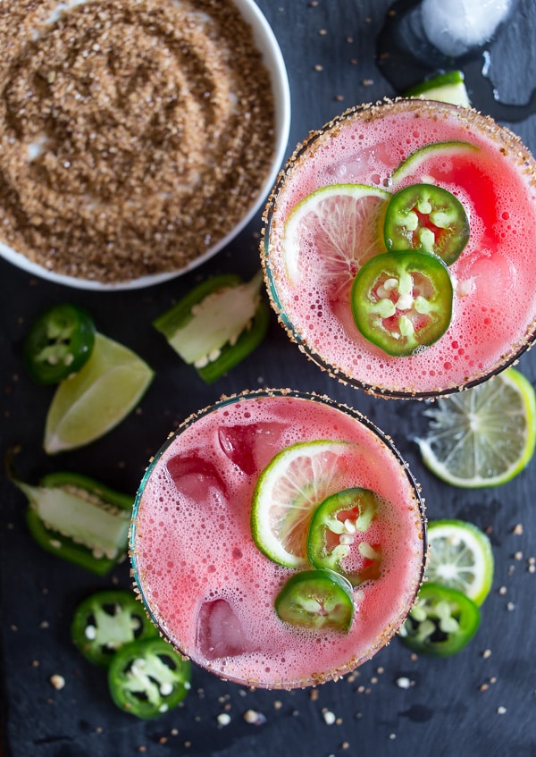 This jalapeno watermelon margarita is your new favorite margarita. The perfect balance of sweet and spicy and made with fresh pureed watermelon and spiked with jalapenos and just a splash of tequila, lime juice and orange liqueur. This is the spicy cocktail of your dreams.