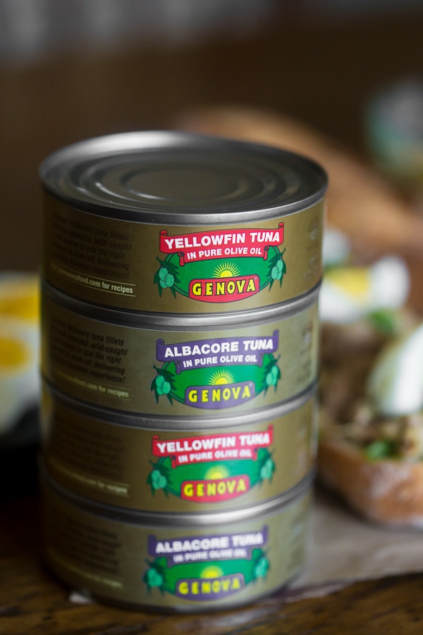 Cans of olive oil packed tuna stacked on top of each other. 