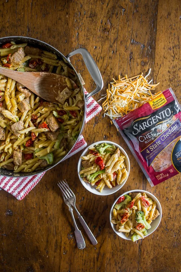 The one pot cheddar cajun pork pasta is packed full of broccoli, slow roasted cherry tomatoes, sharp cheddar cheese and LOTS of cajun spiced pork. You'll love how simple this dish is to make and the cleanup is a breeze since it's all made in the same pot! 